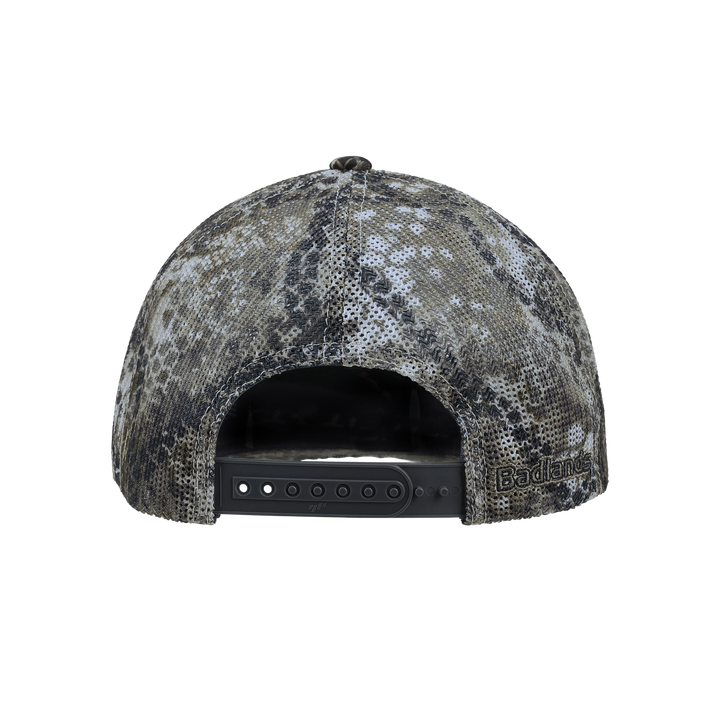 Back view of a Badlands camo snapback hat with embroidered Badlands logo and skull on the side.