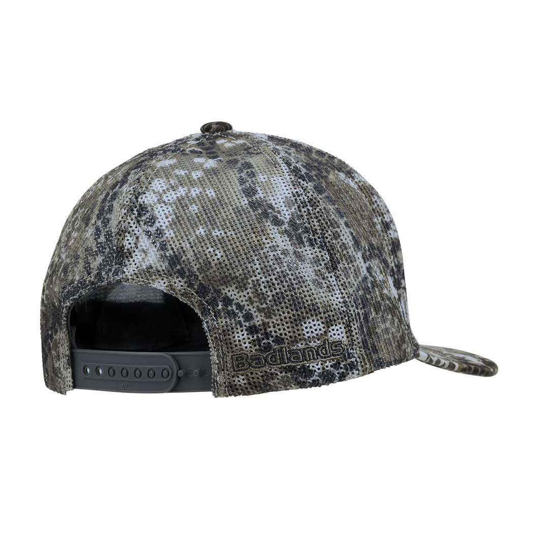 Back view of a camo Badlands snapback hat with embroidered Badlands logo and adjustable strap.