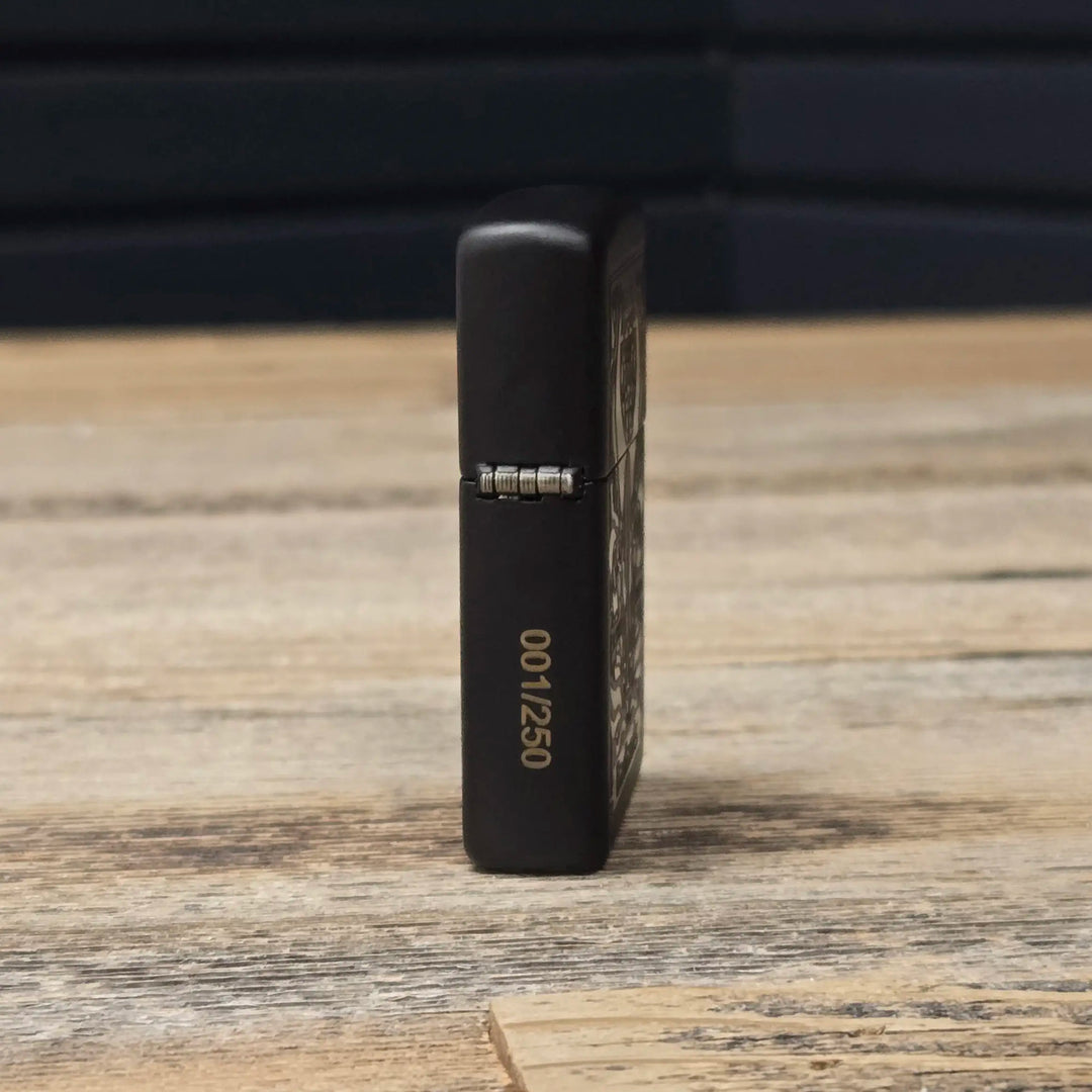Black Badlands lighter on wood table, numbered 001/250, with visible skull logo on the front.