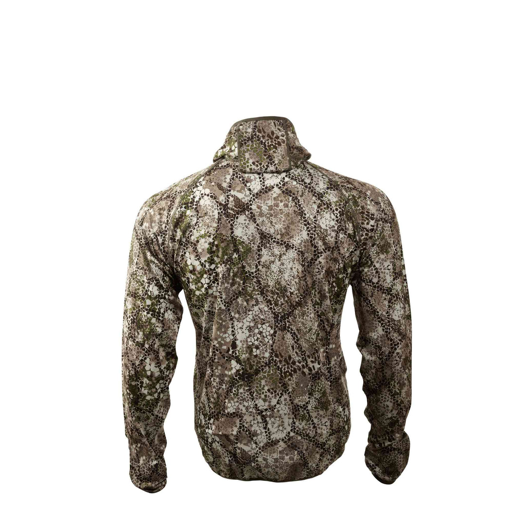 Back view of a Badlands camo jacket with a subtle skull logo, featuring earth-tone patterns for outdoor concealment.