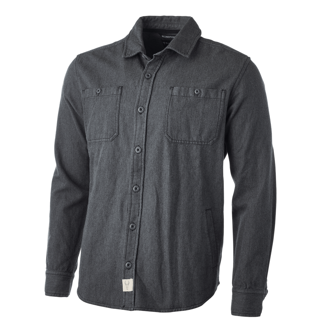 Dark gray Badlands shirt with two chest pockets and logo skull tag near hem, designed for outdoor comfort and durability.