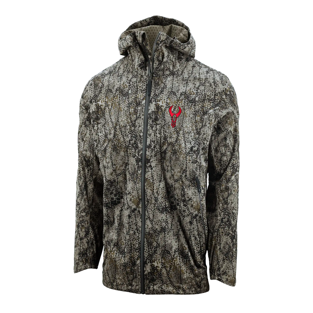 Camo jacket with hood, front zipper, and red Badlands skull logo on chest. Ideal for outdoor or hunting use.