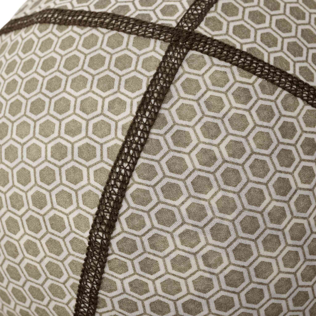 Close-up of Badlands fabric with hexagonal pattern and reinforced stitching; durable material for outdoor gear.