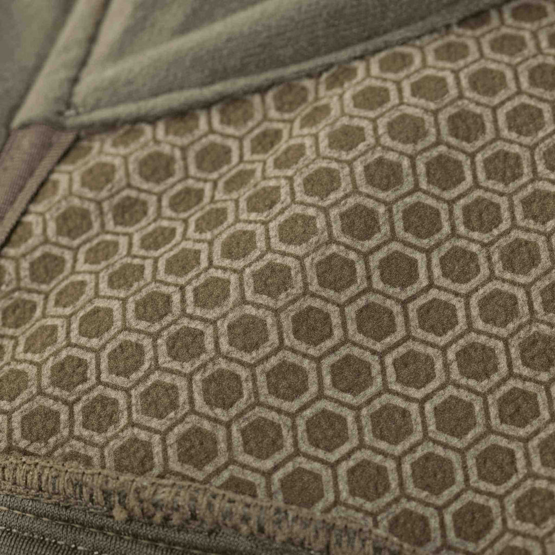 Close-up of Badlands fabric with a hexagonal pattern, featuring subtle Badlands skull logos within each hexagon.
