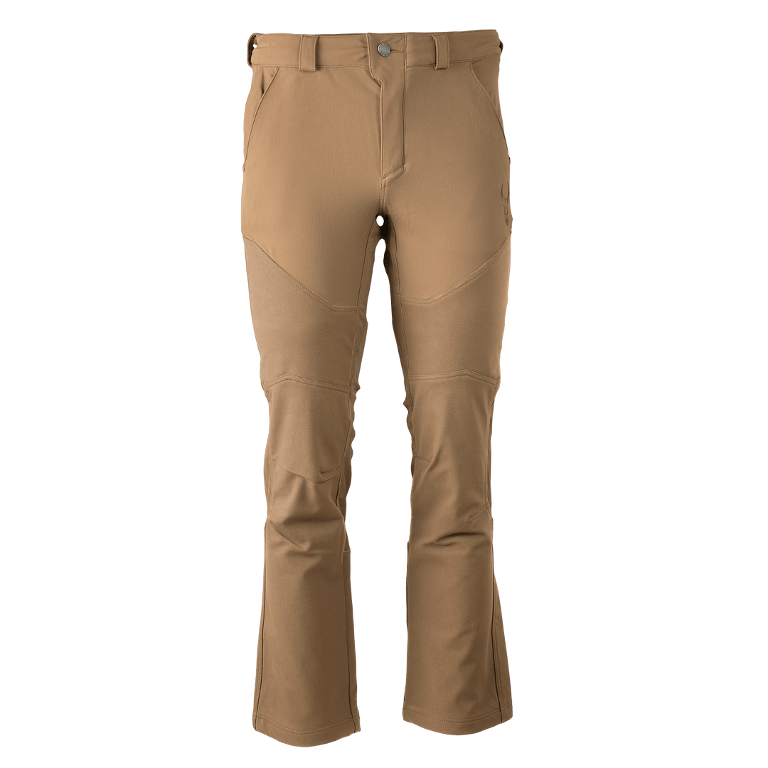 Tan Badlands hunting pants with articulated knees and subtle skull logo on thigh; front view, isolated on white.