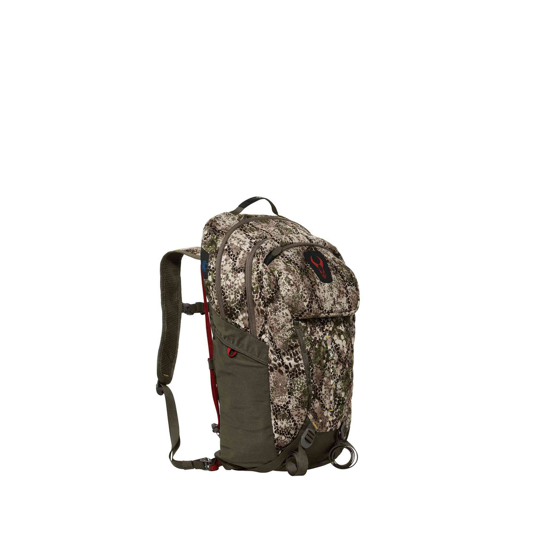 Camo Badlands backpack with red skull logo on top flap, adjustable straps, and multiple compartments.