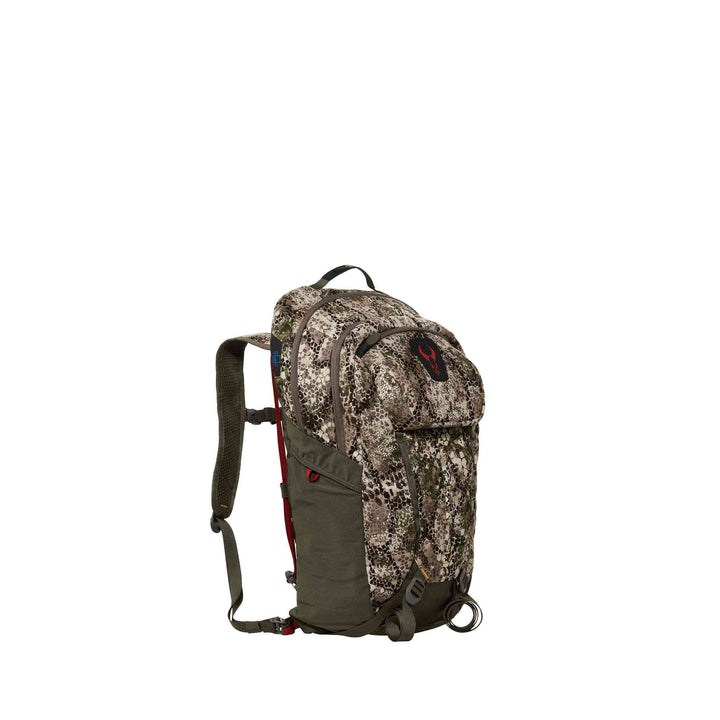 Camo Badlands backpack with red skull logo on top flap, adjustable straps, and multiple compartments.