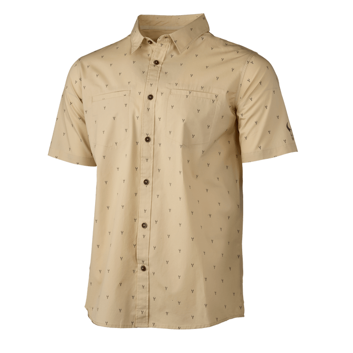 Tan Badlands short-sleeve shirt with subtle skull logo print, chest pocket, and button front.
