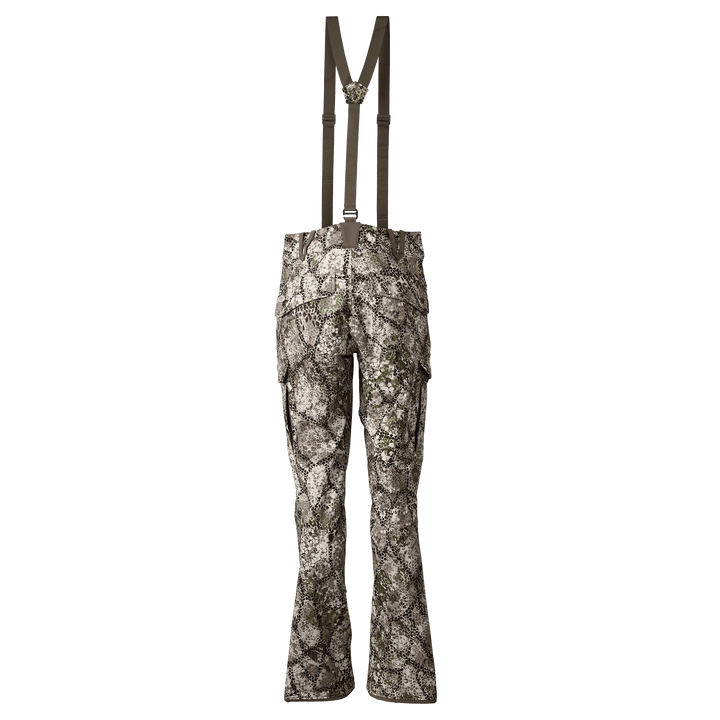 Rear view of Badlands camo hunting pants with suspenders and Badlands skull logo on the waistband.