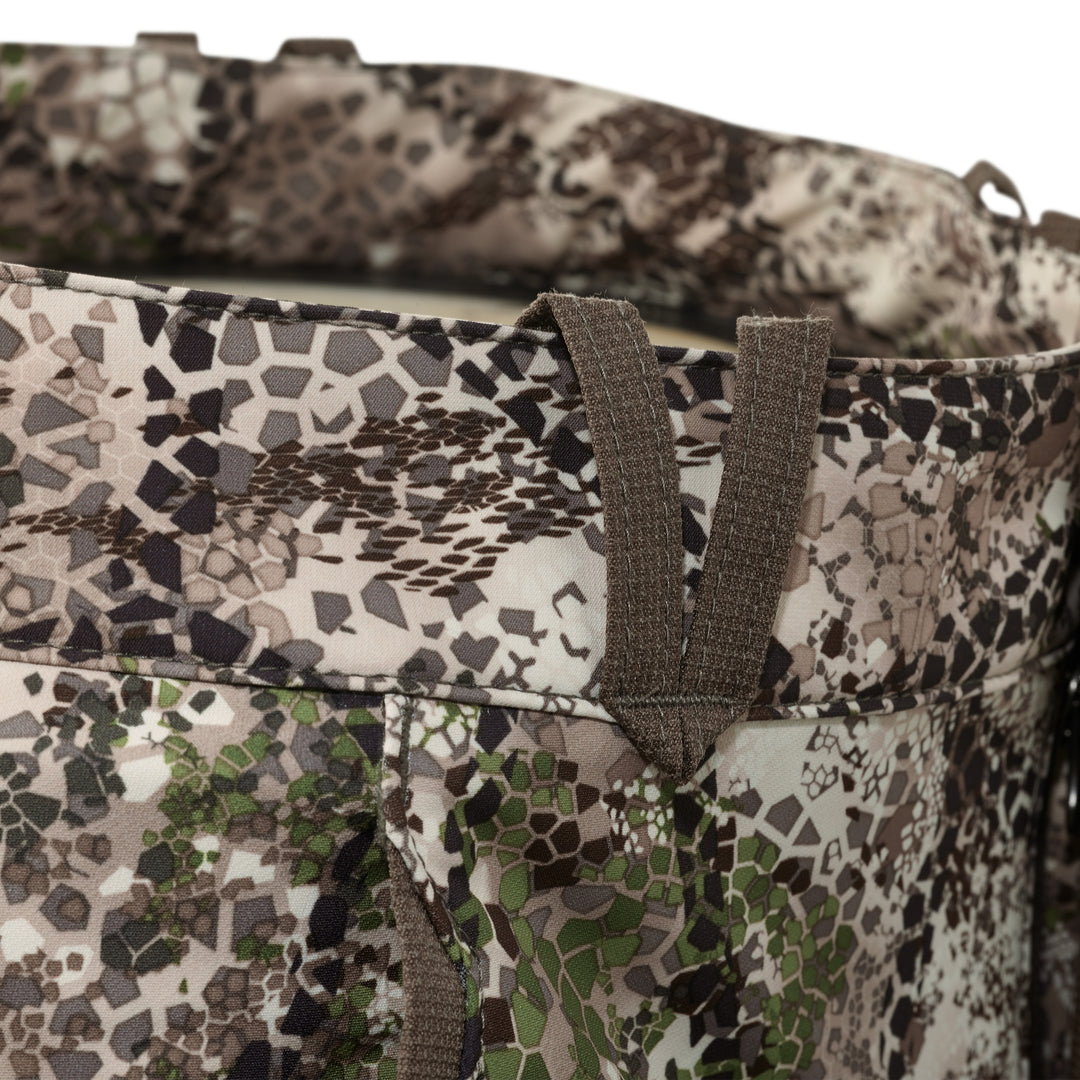 Close-up of Badlands camo fabric with belt loops; no visible Badlands skull logo in this image.