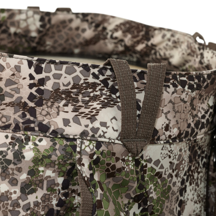 Close-up of Badlands camo fabric with belt loops; no visible Badlands skull logo in this image.