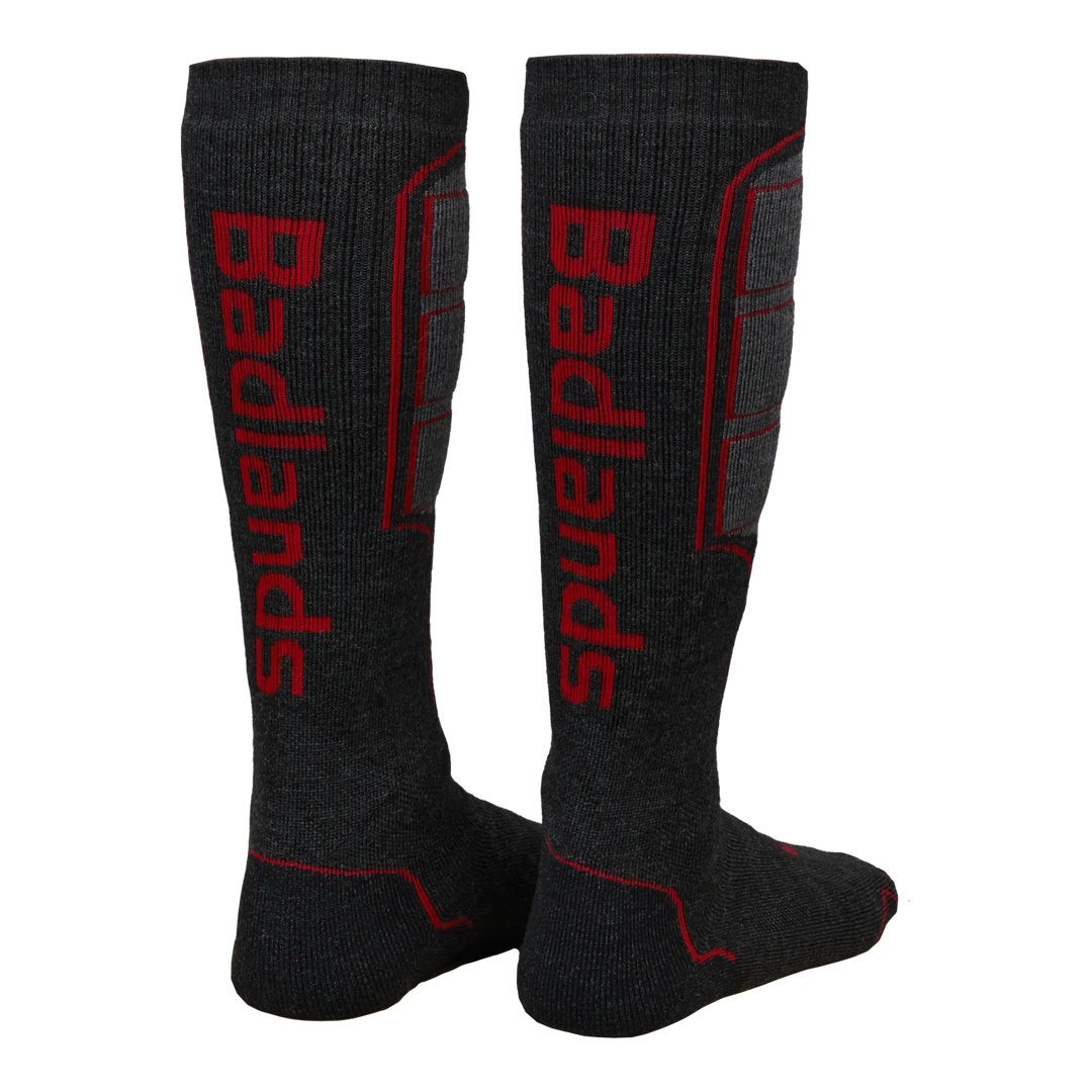 Two tall, dark gray Badlands socks with red logo and accents, featuring the Badlands skull logo on the back.