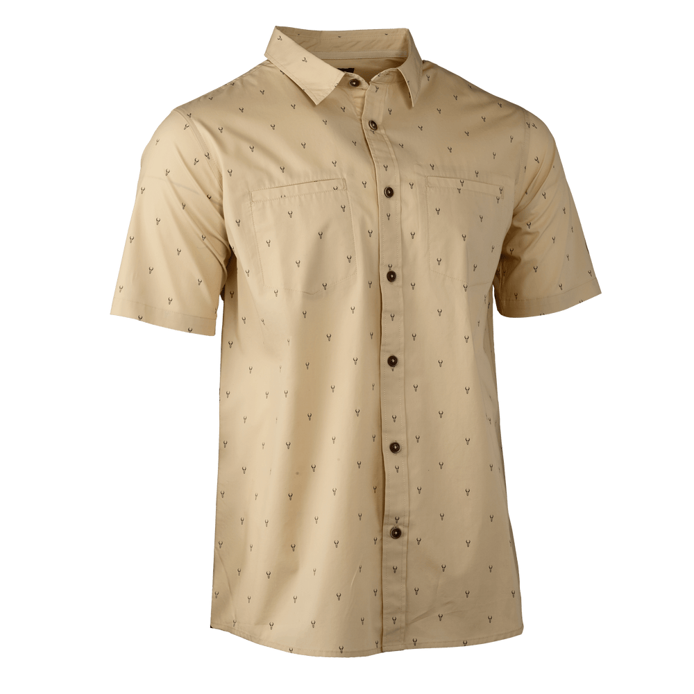 Tan short-sleeve button-up shirt with subtle Badlands skull logo print, two chest pockets, and dark buttons.