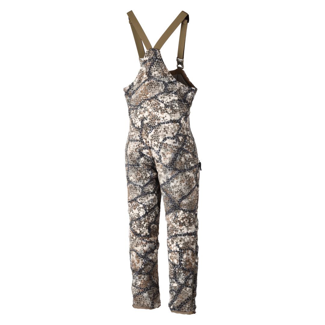 Badlands camo hunting bib with adjustable straps, featuring the Badlands skull logo.
