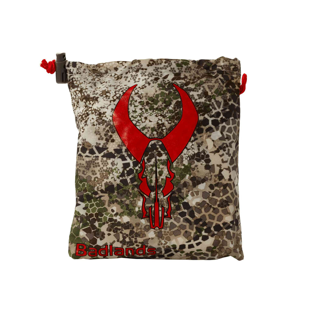 Camo Badlands pouch with red Badlands skull logo and drawstring closure, designed for outdoor or hunting gear storage.