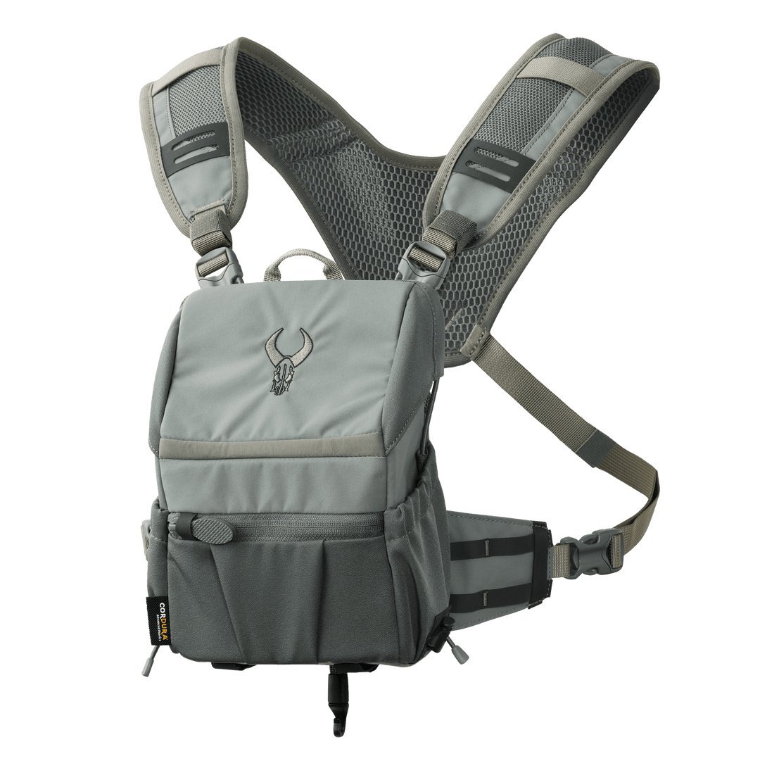 Gray Badlands chest pack with mesh straps and skull logo, designed for outdoor gear storage and easy access.