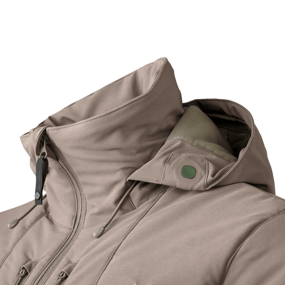 Tan Badlands jacket with high collar, zipper, and drawstrings; Badlands skull logo on snap button.