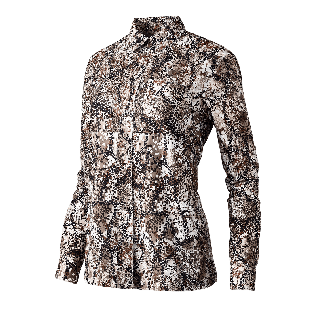 Women's Badlands camo hunting shirt with long sleeves and button front, featuring the Badlands skull logo.