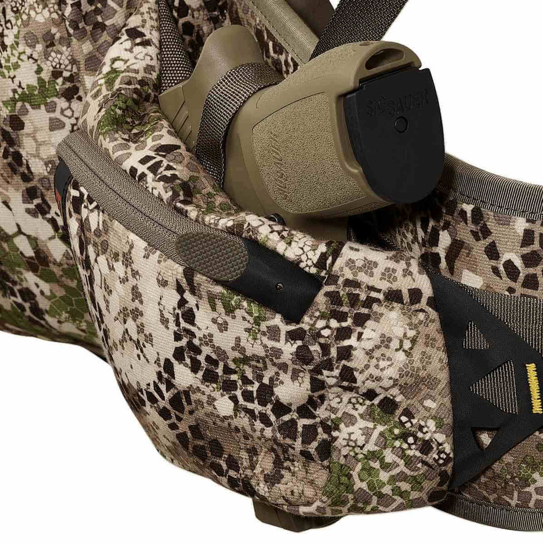 Badlands camo pack with holstered SIG SAUER pistol; Badlands skull logo visible on the right side.