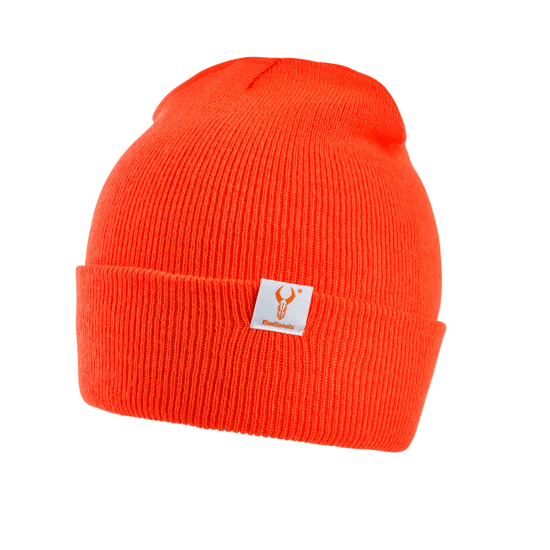 Bright orange knit beanie with a folded cuff and Badlands skull logo patch on the front.