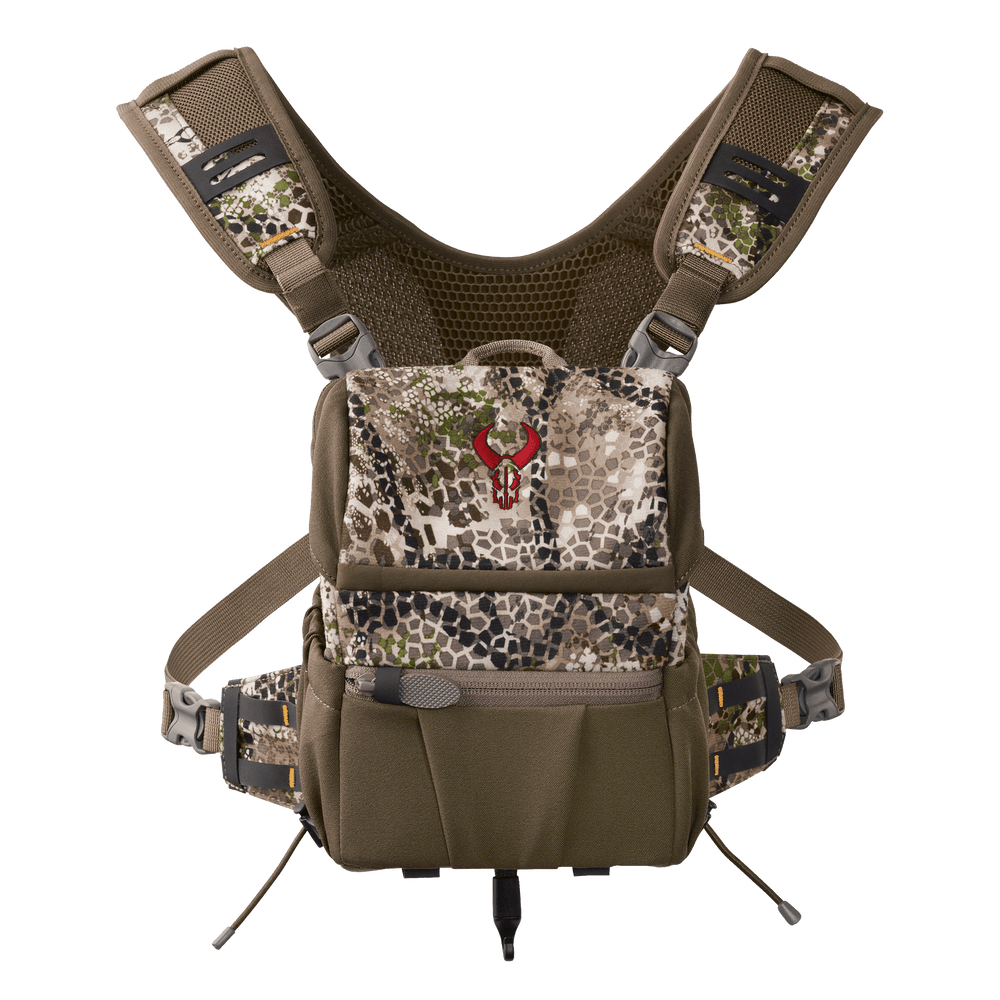 Badlands camo chest pack with red skull logo, adjustable straps, and multiple compartments for outdoor gear.