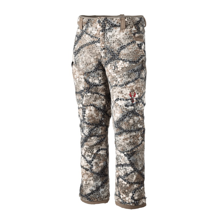 Badlands camo hunting pants with fleece texture and red skull logo on the thigh, designed for outdoor use.