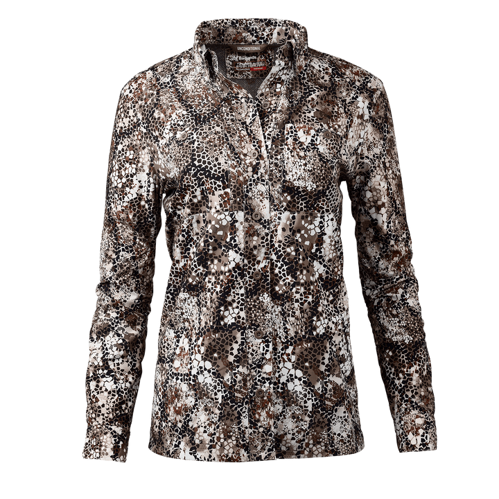 Women's Badlands camo hunting shirt with long sleeves and subtle Badlands skull logo on collar.