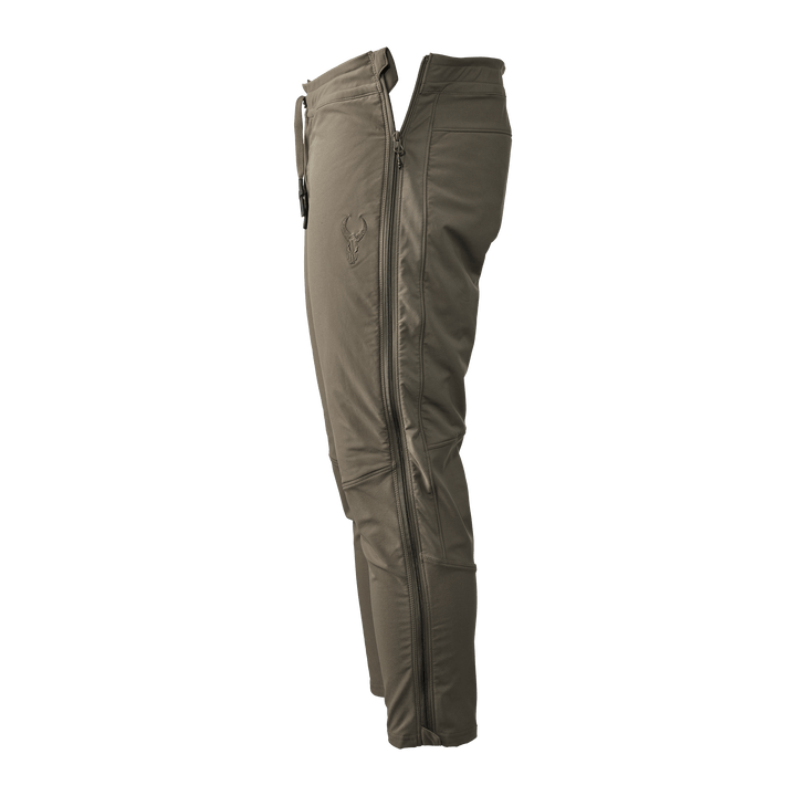 Olive Badlands hunting pant with full side zipper and embroidered skull logo on thigh, shown in profile view.