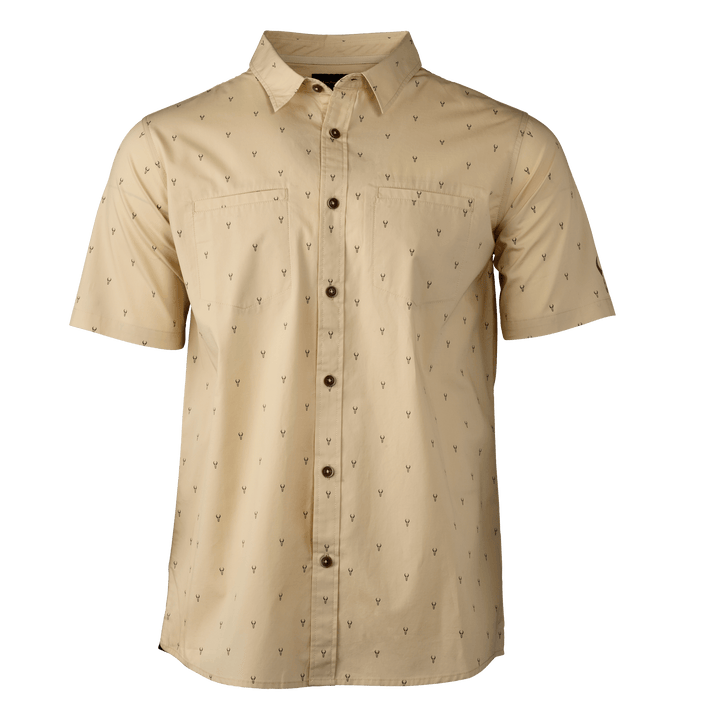 Tan short-sleeve button-up shirt with subtle Badlands skull logo print and two chest pockets.
