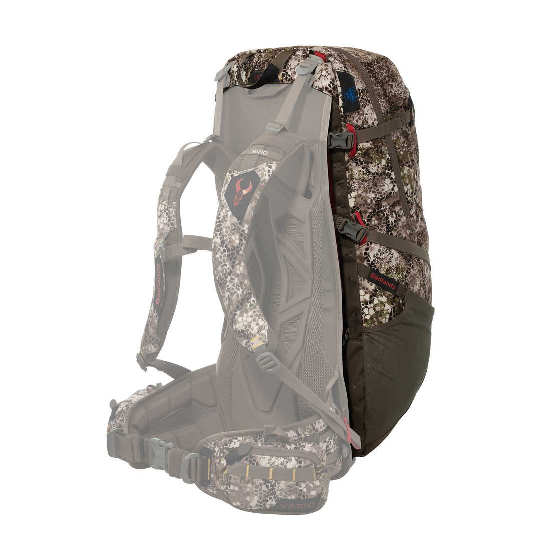 Badlands camo hunting backpack with Vario frame, featuring the red Badlands skull logo on the shoulder strap.