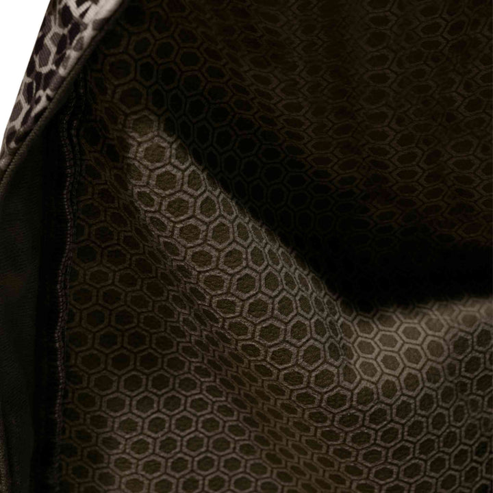 Close-up of Badlands jacket lining with hexagonal pattern for durability and comfort; subtle Badlands skull logo detail.