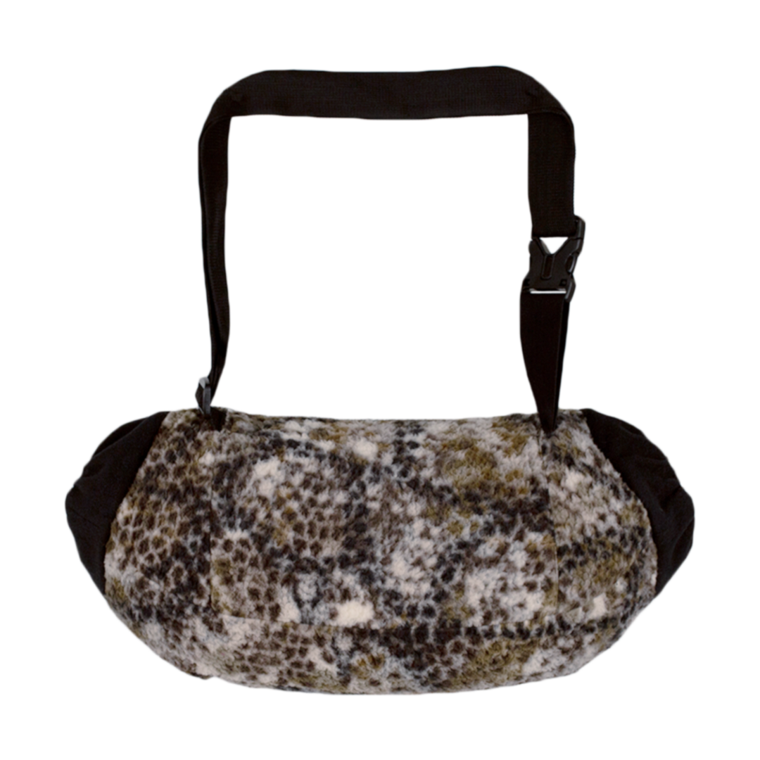 Badlands camo muff handwarmer with adjustable strap and soft fleece exterior; features the Badlands skull logo.