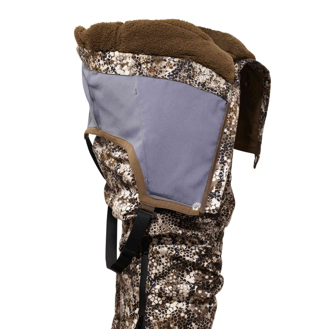 Badlands camo hood with fleece lining, adjustable straps, and signature skull logo for outdoor use.