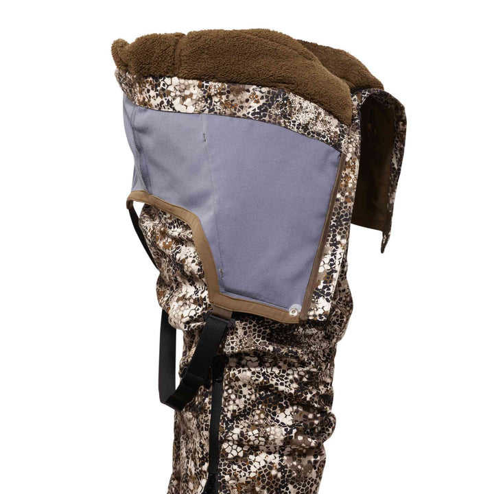 Badlands camo hood with fleece lining, adjustable straps, and signature skull logo for outdoor use.