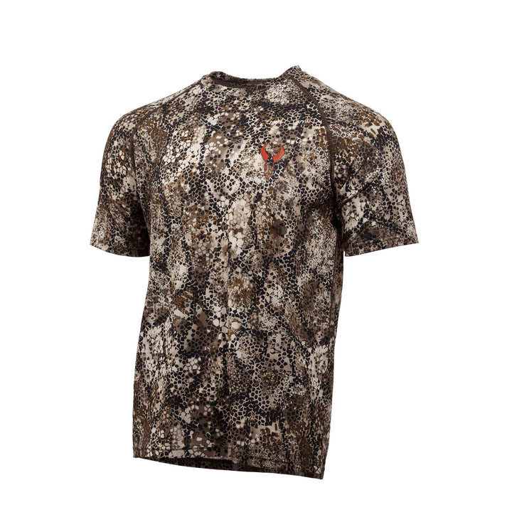 Short sleeve camo shirt with Badlands skull logo on chest; brown, tan, and black pattern for outdoor use.