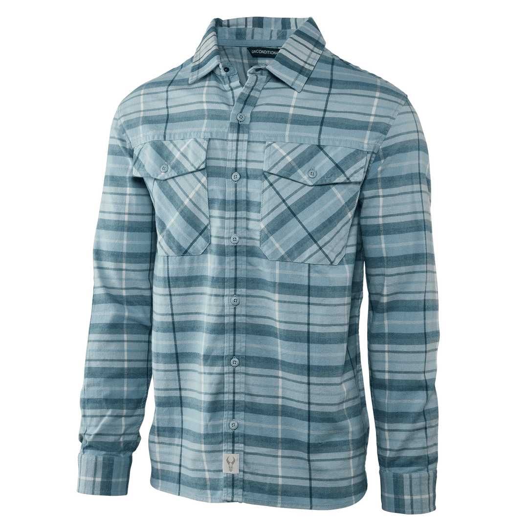Light blue plaid Badlands shirt with long sleeves, button front, chest pockets, and skull logo tag at hem.