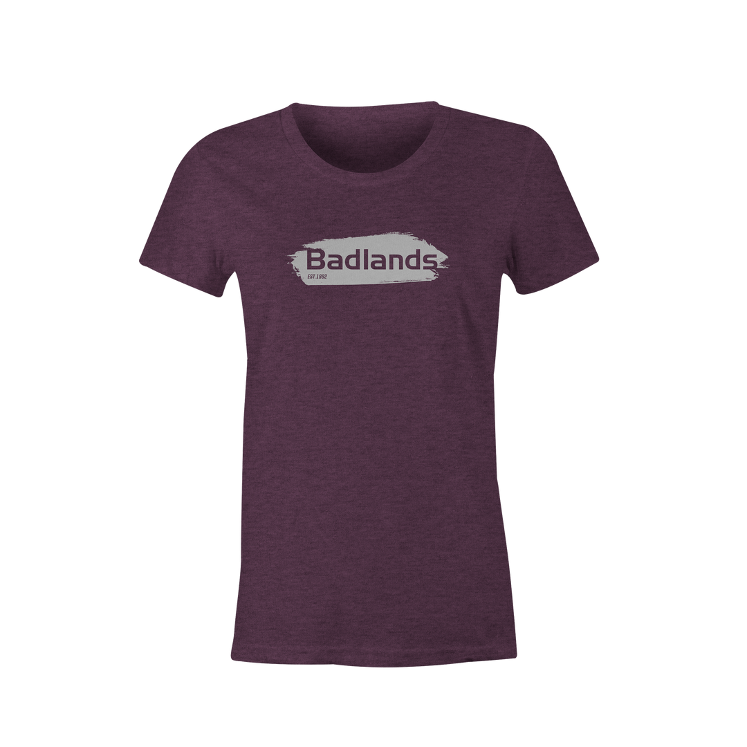 Purple women's t-shirt with Badlands logo and skull graphic on chest, short sleeves, crew neck.