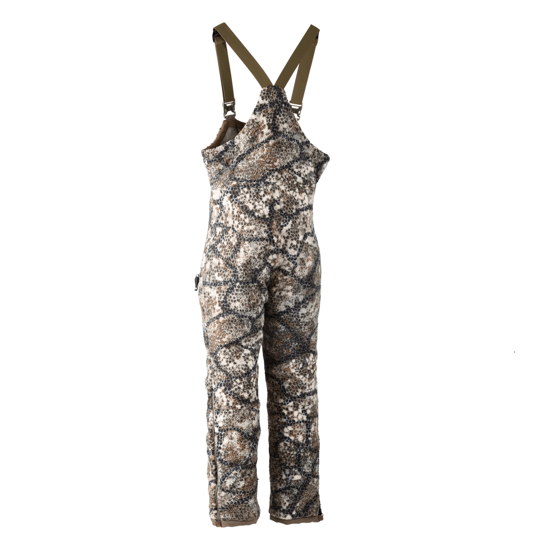 Badlands camo hunting bib with adjustable straps and skull logo, designed for outdoor use and weather protection.