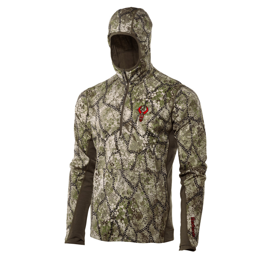 Badlands camo hoodie with red skull logo on chest, half-zip front, and long sleeves; designed for outdoor use.