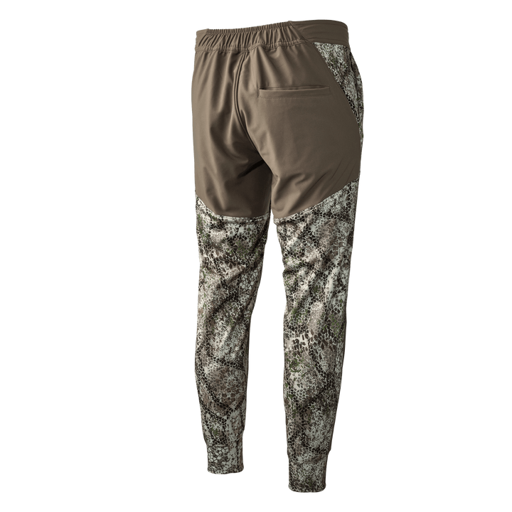 Badlands camo hunting pants, brown and camo pattern, elastic waist, back pocket, skull logo not visible.