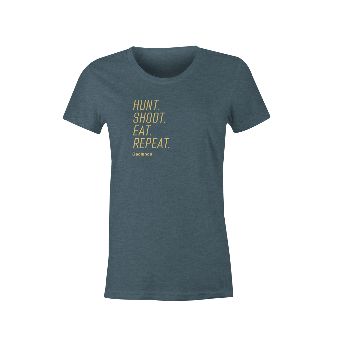 Blue Badlands shirt with yellow text: "Hunt. Shoot. Eat. Repeat." and Badlands logo below.