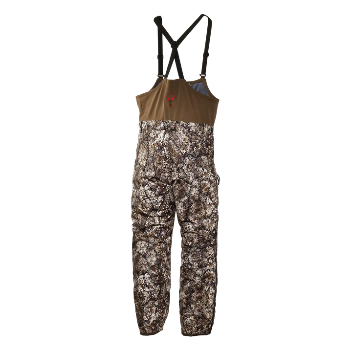 Badlands camo hunting bib with adjustable straps and red skull logo on chest.
