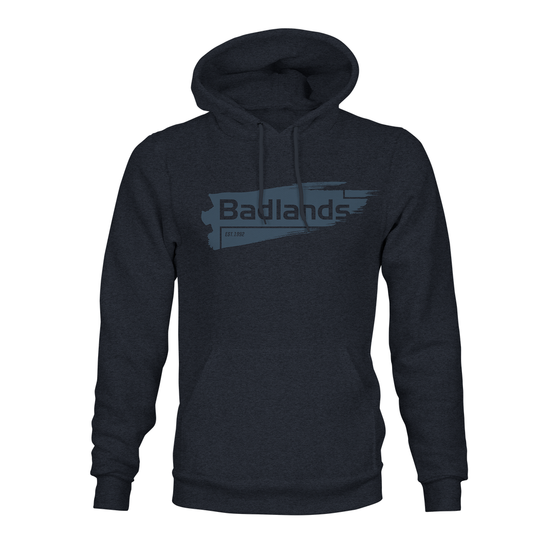 Dark hoodie with "Badlands" and logo on chest, featuring a blue brushstroke design and "EST. 1992" text.