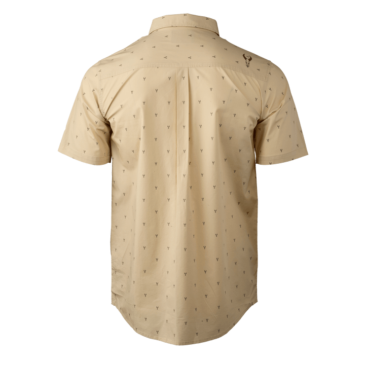 Tan short-sleeve shirt with subtle antler print and Badlands skull logo on upper back.
