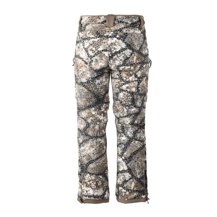 Badlands camo hunting pants with neutral tones and signature skull logo on waistband, designed for outdoor concealment.