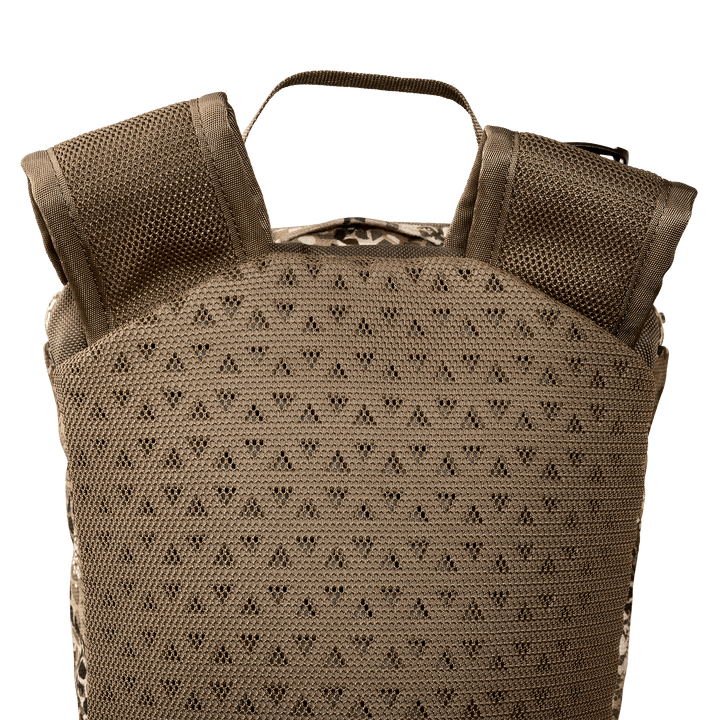 Close-up of a Badlands backpack’s padded, breathable back panel and shoulder straps in tan color.