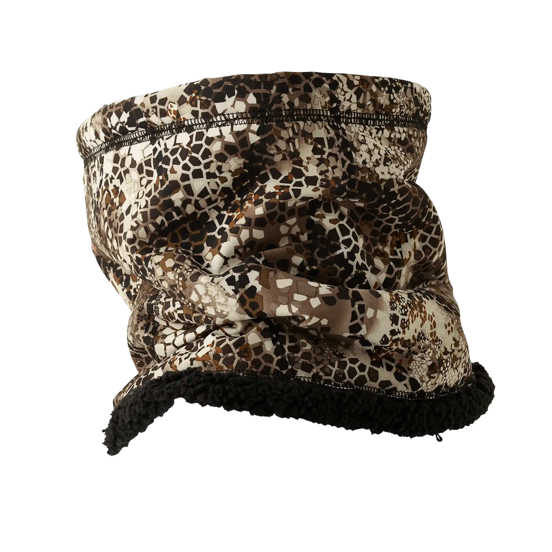 Badlands camo neck gaiter with fleece lining; features Badlands skull logo for outdoor and hunting use.