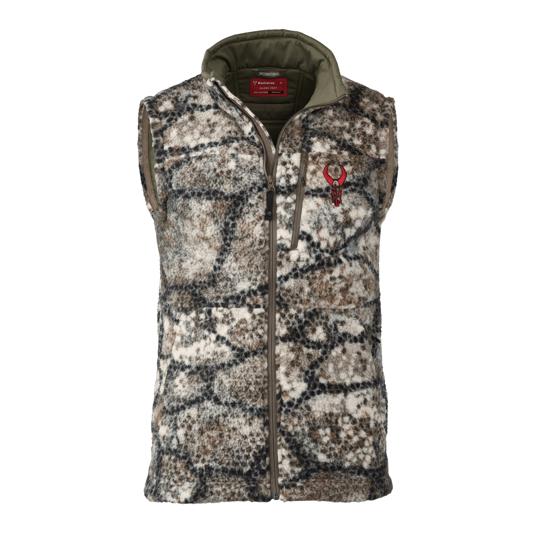 Badlands camo fleece vest with front zipper and red skull logo on chest, designed for outdoor and hunting use.