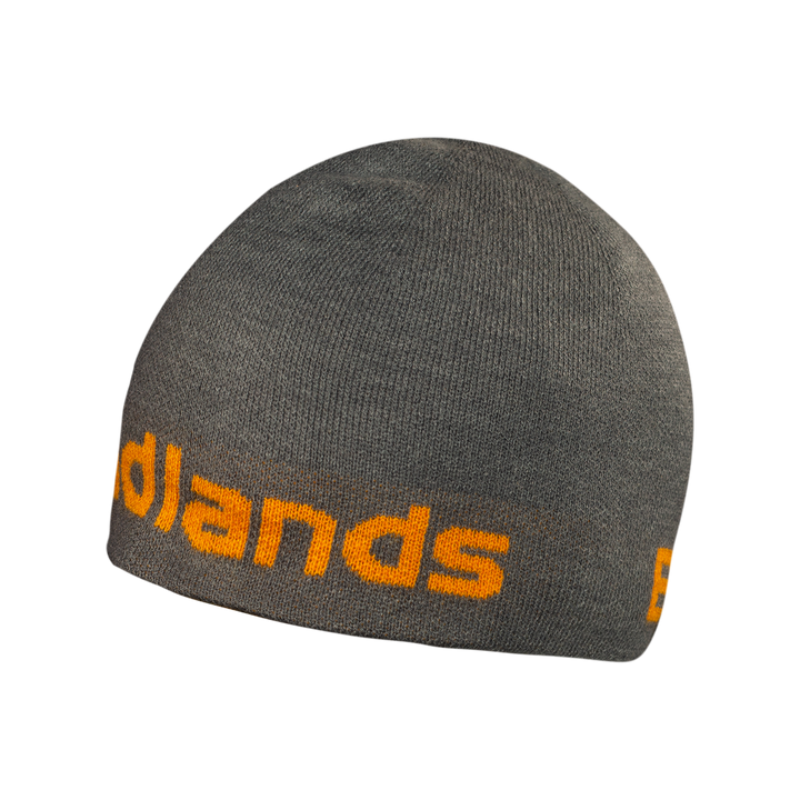 Gray knit beanie with orange "Badlands" text and Badlands skull logo, designed for warmth and outdoor use.