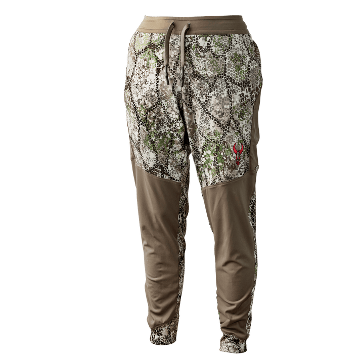 Badlands camo jogger pants with tan panels and red skull logo on right thigh, designed for outdoor and hunting use.
